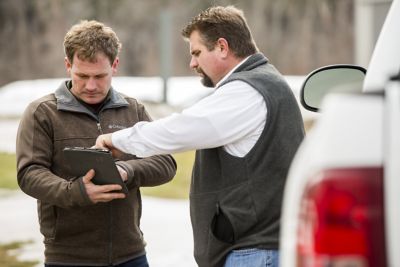Farmer and rep reviewing data