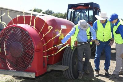 Farm equipment & 3 men in high vis