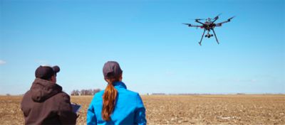 farmers driving drone