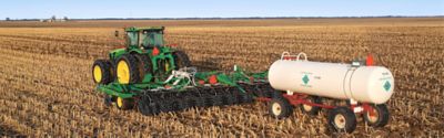 Nitrogen tank behind tractor in field