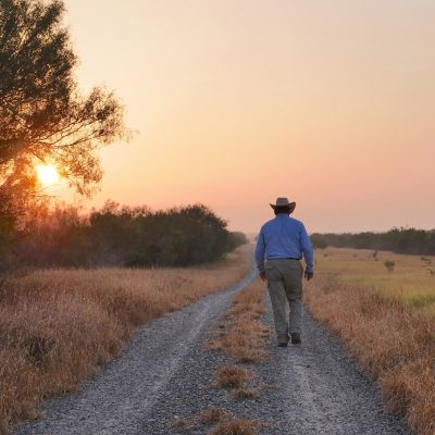 Texas man walking at sundown