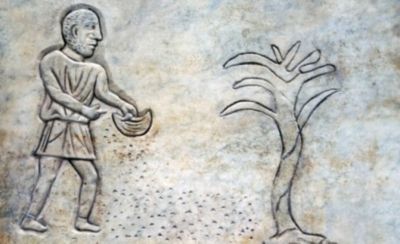 Bas-relief of an ancient Roman farmer throwing seeds on the ground. In the the public Baths of Diocletian in Rome, Italy. It was built from 298 to 306