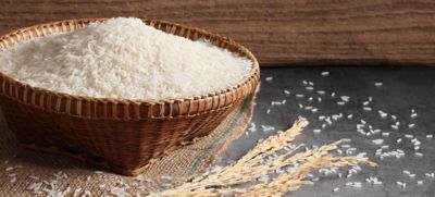 wicker bowl filled with rice on a burlap mat