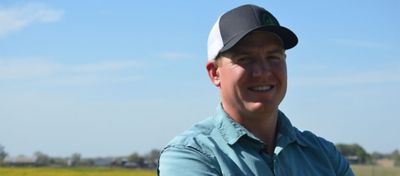 Bryant Kagay standing in a pasture