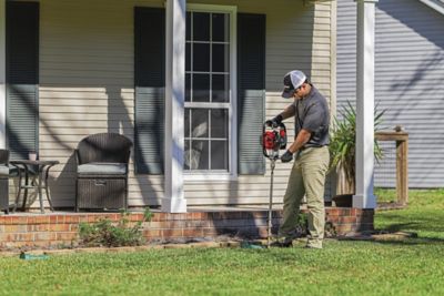 Certified Sentricon Specialist installing Sentricon in-ground bait stations
