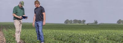 Enlist Field Specialist and Farmer in field with tablet