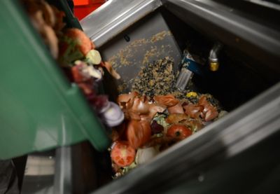 Food_Waste Food being poured into a Waste Bin
