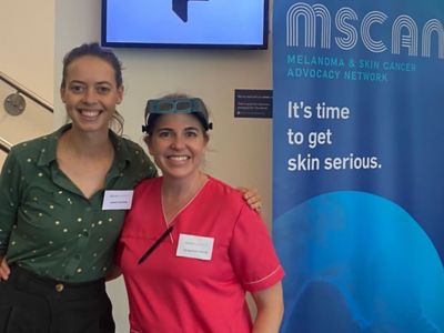 MSCAN helper Jessie (left) with dermatologist Dr Melissa Carroll, who performed free skin checks at the conference.