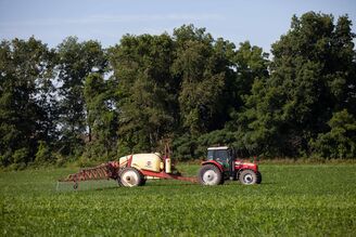 Side of sprayer in wheat field