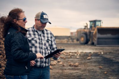 Woman and man looking at iPad