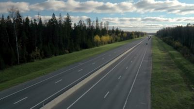 Two lane highway with trees on each side