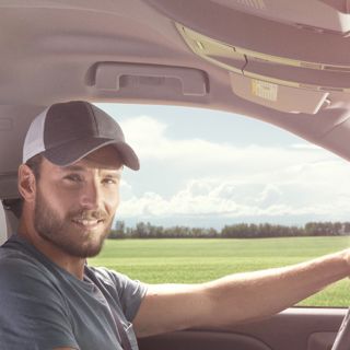 Farmer in Truck Cab