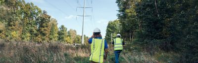 Utility workers walking ROW
