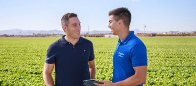 Jose-and-Farmer-Smiling-In-The-Field