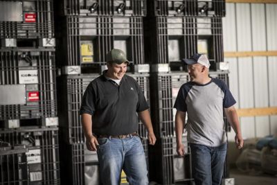 Farmer and rep with bulk boxes