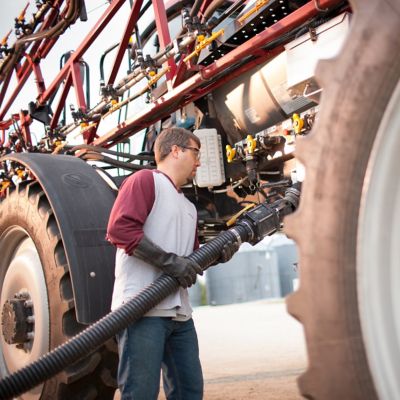 Farmer filling sprayer