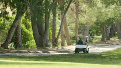 golf course super in a cart