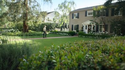 Lawncare person maintaining yard 