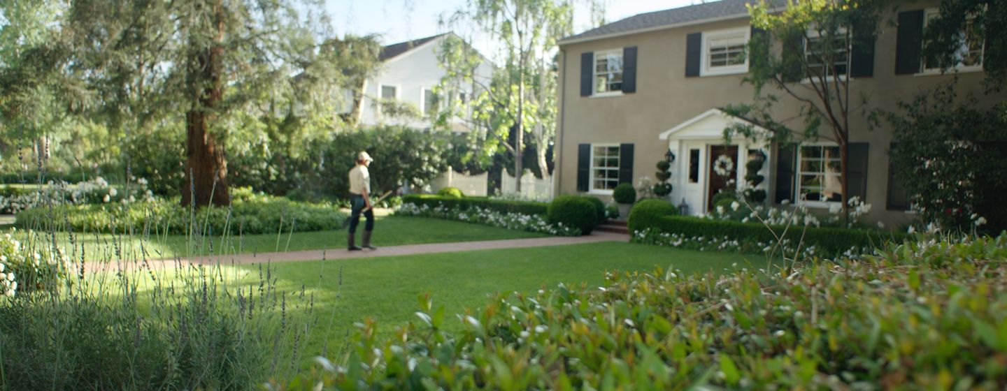 Lawncare person maintaining yard 