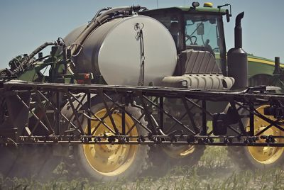 Sprayer applying crop protection products to corn field