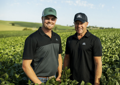 Two Pioneer Representatives in a soybean field