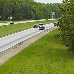 Image of four lane highway with grass median