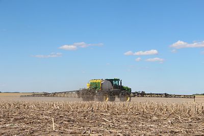 Sprayer in harvested corn field -No til soybeans