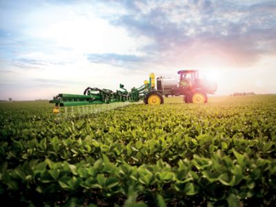 spraying soybeans at sunrise