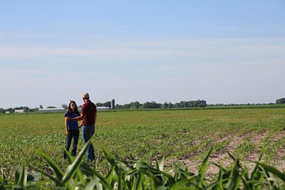 Territory manager in field with customer