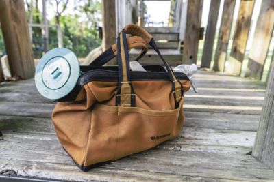 A toolbag with a Sentricon in-ground bait station