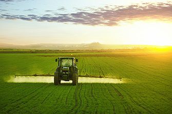 tractor working in field of wheat