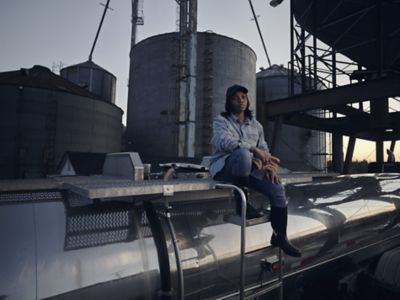 Woman in front of silos