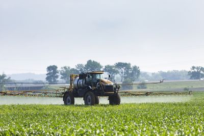 sprayer in corn field