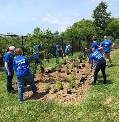 Volunteers with Corteva™ Grows working in a garden