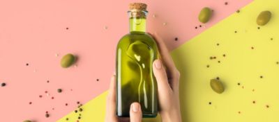 bottle-of-olive-oil-in-hands
