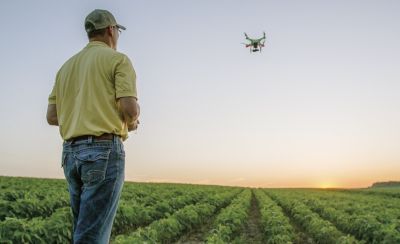 farmer-flying-drone-over-soybean-field