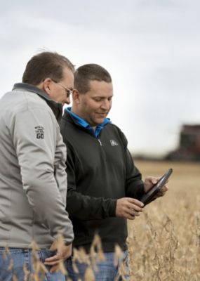 Inspecting harvest soybean field