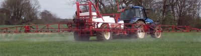 sprayer in wheat field