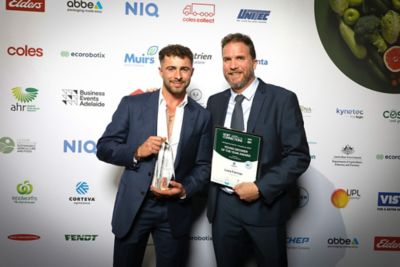 Luca Farmer of The Farmer Group accepts the Corteva Young Grower of the Year Award, presented by Nick Koch., Corteva Horticultural Manager