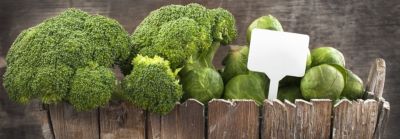 wooden crate full of broccoli