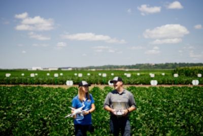 man and woman in crop field