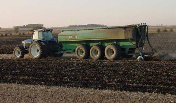 Photo of field operation with trailer using multiple axles.