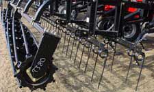 Using packers to firm seedbeds.