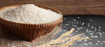 wicker bowl filled with rice on a burlap mat
