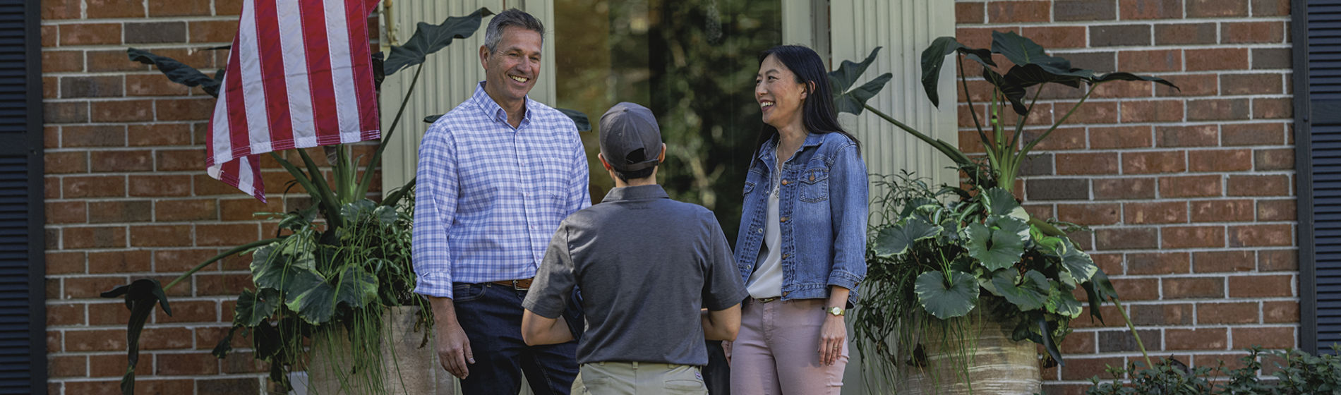 Certified Sentricon Specialist greets homeowners on front porch
