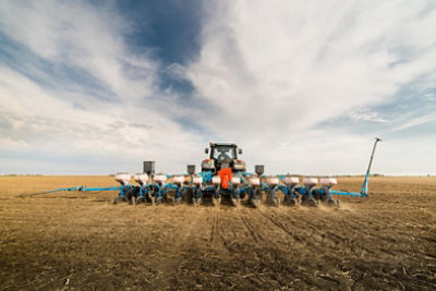Farmer seeding crops
