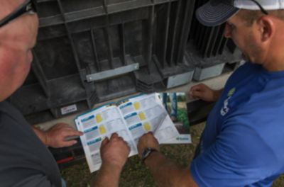 Farmers reviewing Enlist traits