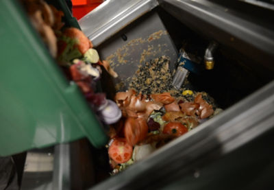 Food_Waste Food being poured into a Waste Bin