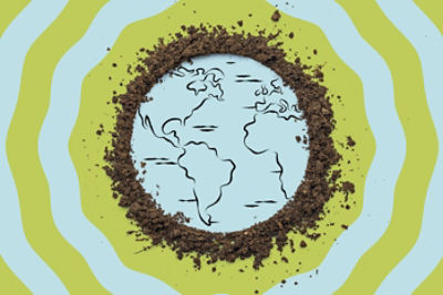 A drawing of a map of Earth with dirt surrounding the drawing.