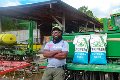 Rep with Pioneer seed bag